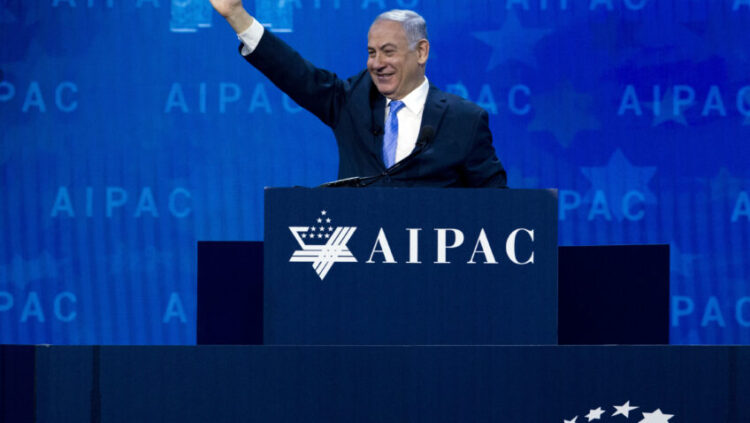 Israeli Prime Minister Benjamin Netanyahu waves to the crowd as he speaks at the 2018 American Israel Public Affairs Committee (AIPAC) policy conference, at Washington Convention Center, Tuesday, March 6, 2018, in Washington. Netanyahu says Iran is responsible for “darkness descending” on the Middle East by building an anti-Israel empire.   (AP Photo/Jose Luis Magana)