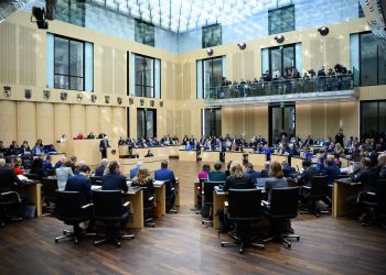 Winfried Kretschmann, Minister President of Baden-Württemberg, speaks at the plenary session of the German Bundesrat. During its session, the chamber of the federal states will discuss, among other things, the reform of the debt brake passed by the Bundestag as a prerequisite for the future federal government's planned multi-billion euro financial package for defense, infrastructure and climate protection measures. Photo: Bernd von Jutrczenka/dpa