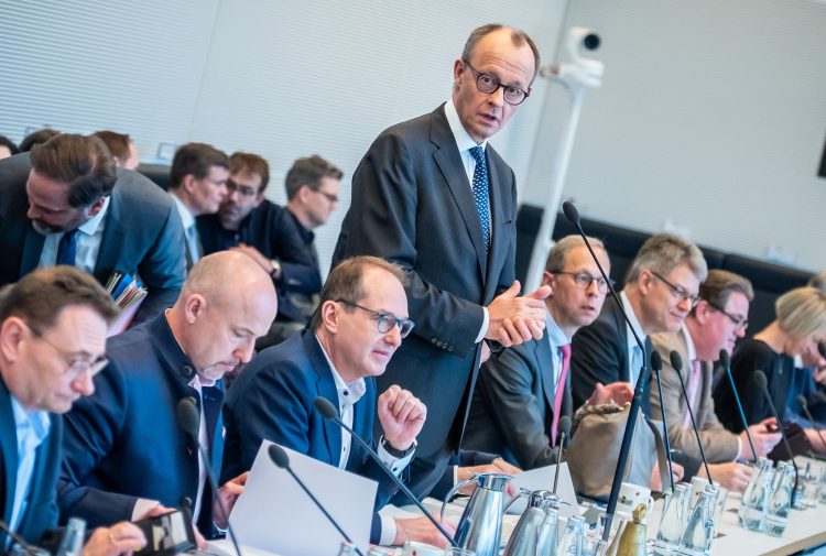14 March 2025, Berlin: Friedrich Merz (C), leader of the Christian Democratic Union of Germany (CDU)/Christian Social Union in Bavaria (CSU) parliamentary group, speaks at the start of the parliamentary group meeting in the Bundestag. After lengthy discussions, the parliamentary group leaders of the CDU/CSU, SPD, and Greens have reached an agreement on a billion-euro defense and infrastructure package. Photo: Michael Kappeler/dpa