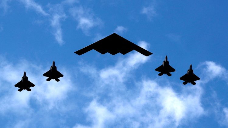 FILE PHOTO: A U.S. Air Force B-2 Spirit Stealth Bomber (C) is flanked by 4 U.S. Marine Corps F-35 fighters during a flyover of military aircraft down the Hudson River and New York Harbor past York City, and New Jersey, U.S. July 4, 2020. REUTERS/Mike Segar/File Photo