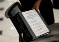 Representative Madeleine Dean, a Democrat from Pennsylvania, reaches for a binder during a television interview at the US Capitol in Washington, DC, US, on Wednesday, July 2, 2025. Donald Trump's multitrillion-dollar tax bill is running into Republican resistance in the House as moderate and ultraconservative GOP lawmakers threaten to defy the president and sink his domestic agenda. Photographer: Kent Nishimura/Bloomberg