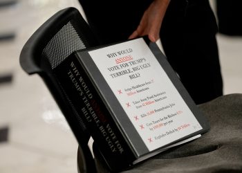 Representative Madeleine Dean, a Democrat from Pennsylvania, reaches for a binder during a television interview at the US Capitol in Washington, DC, US, on Wednesday, July 2, 2025. Donald Trump's multitrillion-dollar tax bill is running into Republican resistance in the House as moderate and ultraconservative GOP lawmakers threaten to defy the president and sink his domestic agenda. Photographer: Kent Nishimura/Bloomberg