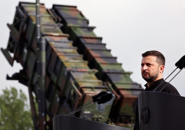 Ukrainian President Volodymyr Zelenskiy looks on during a visit to a military training area to find out about the training of Ukrainian soldiers on the “Patriot” anti-aircraft missile system, at an undisclosed location, in Germany, June 11, 2024.   Jens Buttner/Pool via REUTERS