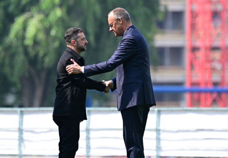 13 August 2025, Berlin: Ukrainian President Volodymyr Zelensky (L) welcomed by German Chancellor Friedrich Merz in the garden of the Federal Chancellery. Photo: John Macdougall/POOL AFP/dpa