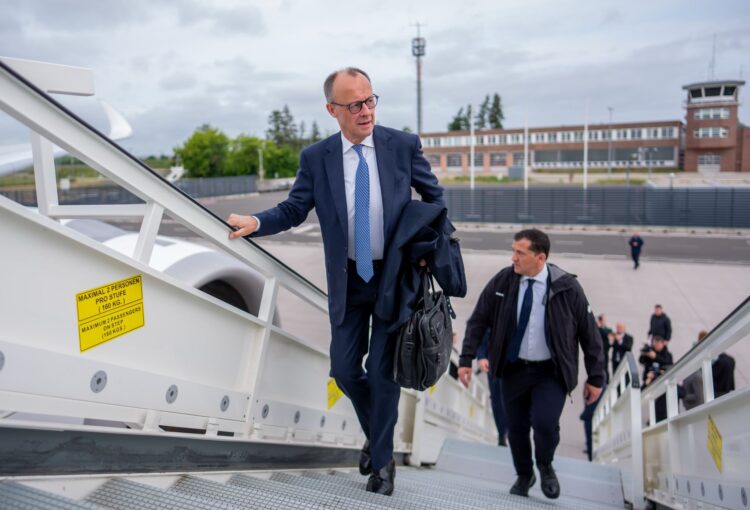 FILED - Federal Chancellor Friedrich Merz climbs into an airplane. Photo: Michael Kappeler/dpa