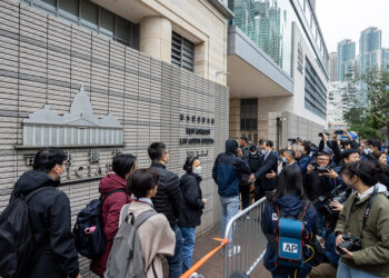 Members of the public wait to enter the West Kowloon Magistrates' Courts ahead of a hearing for former media mogul Jimmy Lai in Hong Kong, China, on Monday, Dec. 18, 2023. After more than 1,000 days in prison, the biggest target in Hong Kong's crackdown on dissent, Lai, will finally go on trial this week in a case closely scrutinized by Western governments. Photographer: Paul Yeung/Bloomberg