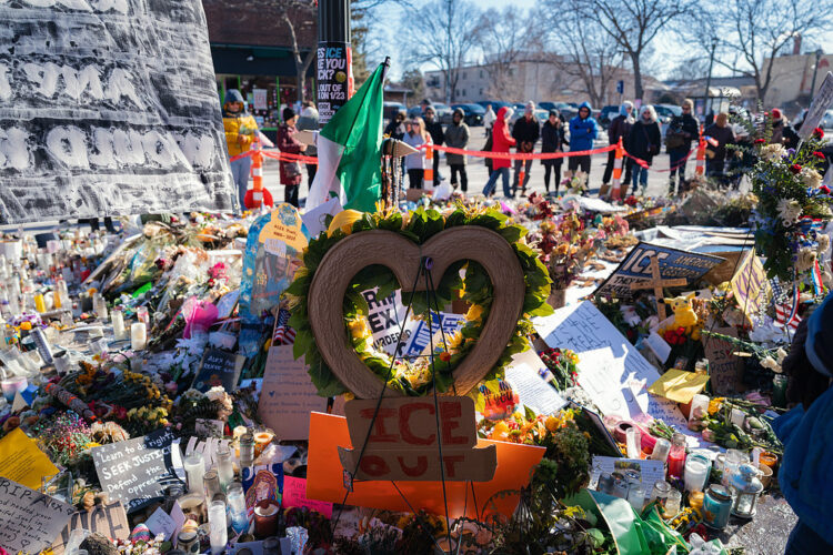 An "ICE Out" sign at a memorial for Alex Pretti near the scene of a fatal shooting by federal law enforcement officers in Minneapolis, Minnesota, US, on Thursday, Jan. 29, 2026. White House Border Czar Tom Homan said the Trump administration will scale down operations in Minnesota and conduct targeted anti-immigration actions. Photographer: Ben Brewer/Bloomberg
