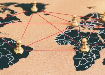 concept of geopolitics or worldwide economy. chess figures placed on map banner