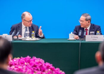 25 February 2026, China, Beijing: German Chancellor Friedrich Merz attends the meeting of the Sino-German Business Advisory Committee in the Great Hall of the People alongside Li Qiang, Premier of China. This is Merz's first visit to China as Federal Chancellor. Photo: Michael Kappeler/dpa pool/dpa