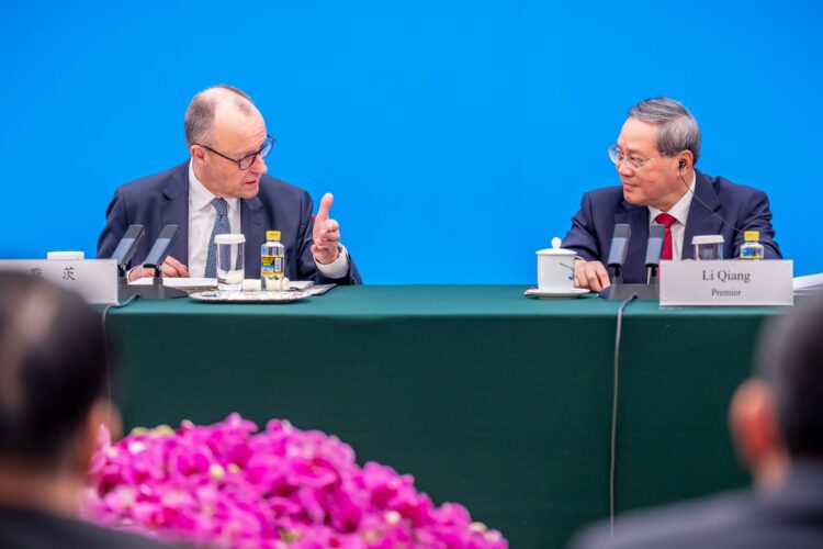25 February 2026, China, Beijing: German Chancellor Friedrich Merz attends the meeting of the Sino-German Business Advisory Committee in the Great Hall of the People alongside Li Qiang, Premier of China. This is Merz's first visit to China as Federal Chancellor. Photo: Michael Kappeler/dpa pool/dpa