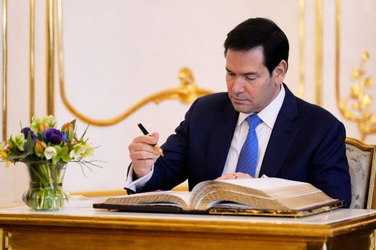 U.S. Secretary of State Marco Rubio writes in a guest book during his meeting with Slovakia's President Peter Pellegrini at the Presidential Palace in Bratislava, Slovakia, Sunday, Feb. 15, 2026. Alex Brandon/Pool via REUTERS