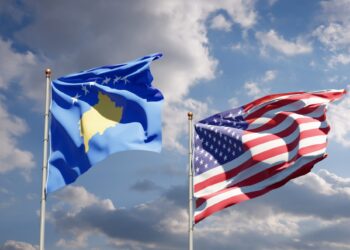 Beautiful national state flags of Kosovo and USA together at the sky background. 3D artwork concept.