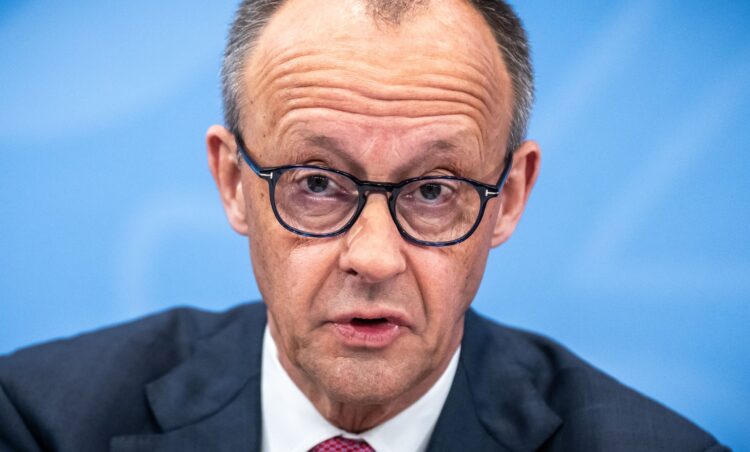 13 April 2026, Berlin: German Chancellor Friedrich Merz (CDU) takes part in the press conference after the coalition committee. In view of the high fuel prices, the black-red coalition is planning to ease the burden on car drivers. To this end, the energy tax on diesel and petrol is to be reduced by around 17 cents gross per liter for a limited period of two months, as announced by the CDU, CSU and SPD in Berlin. Photo: Michael Kappeler/dpa
