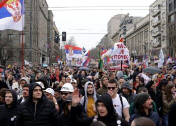 epa11966398 Protesters wave Serbian flags during the student-led rally in Belgrade, Serbia, 15 March 2025. University students staged a protest, demanding accountability after fifteen people lost their lives in the collapse of the Novi Sad Railway Station canopy in November 2024. The station building, which had been renovated and reopened in July 2024, was undergoing further renovations shortly before the collapse.  EPA-EFE/ANDREJ CUKIC