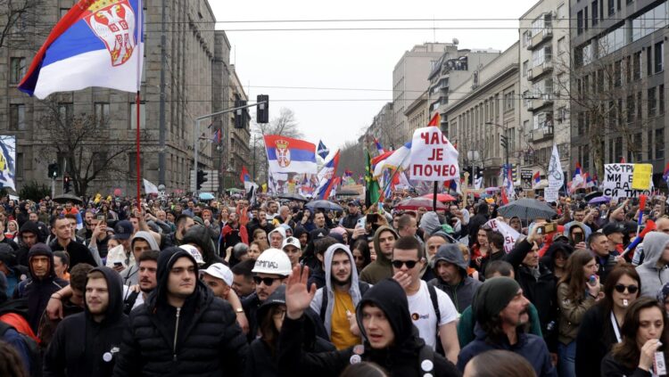 epa11966398 Protesters wave Serbian flags during the student-led rally in Belgrade, Serbia, 15 March 2025. University students staged a protest, demanding accountability after fifteen people lost their lives in the collapse of the Novi Sad Railway Station canopy in November 2024. The station building, which had been renovated and reopened in July 2024, was undergoing further renovations shortly before the collapse. EPA-EFE/ANDREJ CUKIC