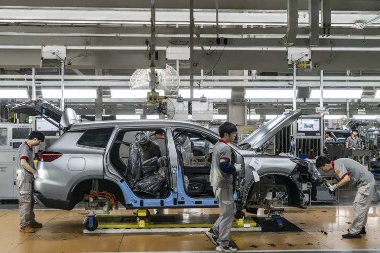 Workers on the assembly line making the Chery Automobile Co. Tiggo 8 at the company's production base in Wuhu, Anhui Province, China, on Wednesday, May 20, 2026. Chinese automakers accounted for more than 15% of electric-vehicle sales in Europe for the first time last month as consumer appetite for models from the country shows no sign of slowing. Photographer: Qilai Shen/Bloomberg