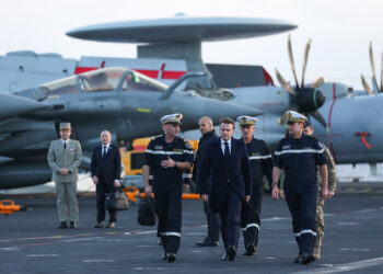 FILE - French President Emmanuel Macron, center right, visits the French aircraft carrier Charles de Gaulle, during his visit to Cyprus, March 9, 2026. (Gonzalo Fuentes/Pool Photo via AP, File)