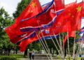A street is decorated with the flags of China and North Korea in Pyongyang, on Monday, June 8, 2026. (AP Photo/Jon Chol Jin)