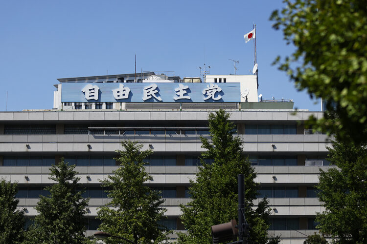 The Japanese flag atop the Liberal Democratic Party (LDP) headquarters in Tokyo, Japan, on Monday, Sept. 8, 2025. Japan’s ruling party faces a tough decision over its future as it searches for a new leader to replace outgoing Prime Minister Shigeru Ishiba, stop the slide in its support at the polls and reassure investors. Photographer: Kiyoshi Ota/Bloomberg