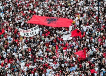 A drone view shows protesters gathered outside the Prime Minister's Office in Tirana, Albania, on June 10, 2026, during the tenth consecutive day of demonstrations against a proposed luxury tourism development project linked to Jared Kushner. Organizers say thousands of people attend the rally. (Photo by Vlasov Sulaj/NurPhoto via Getty Images)