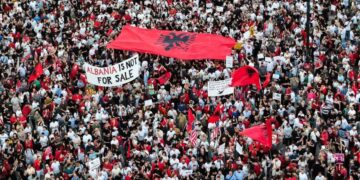 A drone view shows protesters gathered outside the Prime Minister's Office in Tirana, Albania, on June 10, 2026, during the tenth consecutive day of demonstrations against a proposed luxury tourism development project linked to Jared Kushner. Organizers say thousands of people attend the rally. (Photo by Vlasov Sulaj/NurPhoto via Getty Images)