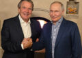 This handout photograph posted on @news_kremlin, the Telegram channel of the Russian presidential press office, on October 8, 2026, shows Russia's President Vladimir Putin and former German chancellor Gerhard Schroeder shaking hands during the celebration of the Russian leader's 74th birthday at an undisclosed location. (Photo by Handout / RUSSIAN PRESIDENTIAL PRESS OFFICE / AFP) / RESTRICTED TO EDITORIAL USE - MANDATORY CREDIT "AFP PHOTO / Russian presidential press office" - HANDOUT - NO MARKETING NO ADVERTISING CAMPAIGNS - DISTRIBUTED AS A SERVICE TO CLIENTS