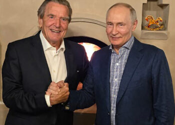 This handout photograph posted on @news_kremlin, the Telegram channel of the Russian presidential press office, on October 8, 2026, shows Russia's President Vladimir Putin and former German chancellor Gerhard Schroeder shaking hands during the celebration of the Russian leader's 74th birthday at an undisclosed location. (Photo by Handout / RUSSIAN PRESIDENTIAL PRESS OFFICE / AFP) / RESTRICTED TO EDITORIAL USE - MANDATORY CREDIT "AFP PHOTO / Russian presidential press office" - HANDOUT - NO MARKETING NO ADVERTISING CAMPAIGNS - DISTRIBUTED AS A SERVICE TO CLIENTS